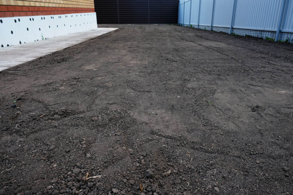 Preparing the site for sowing lawn grass, leveling the soil
